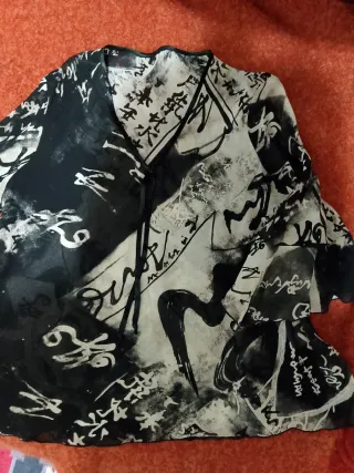 Blusa con maniche a volant