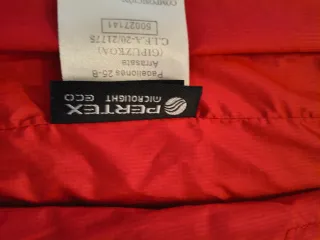 Chaleco Ternua Primalot Azul y Rojo.