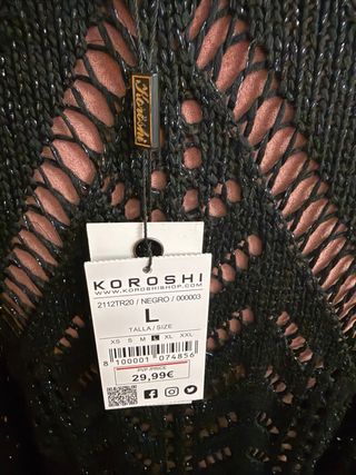 Blusa color negro con hilo plateado. Nueva