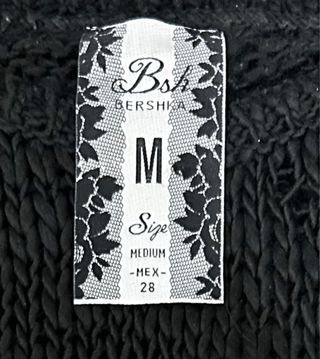 Jersey Bershka negro labios dorados