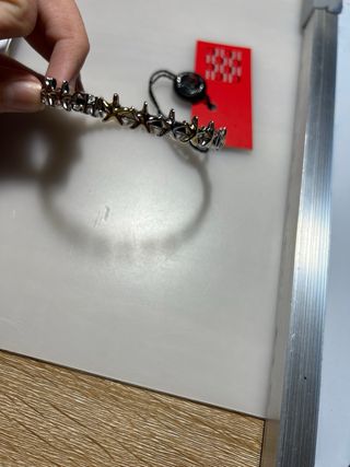 Pulsera Carolina Herrera estrellas oro y plata