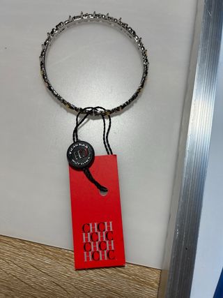 Pulsera Carolina Herrera estrellas oro y plata