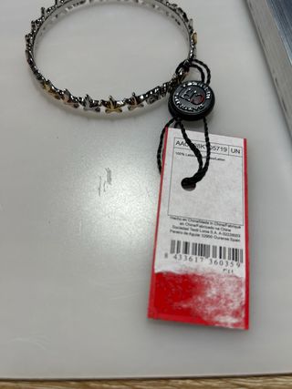 Pulsera Carolina Herrera estrellas oro y plata