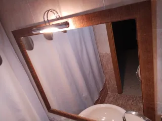 Espejo con aplique de luz