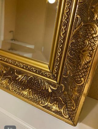 Espejo dorado tallado biselado