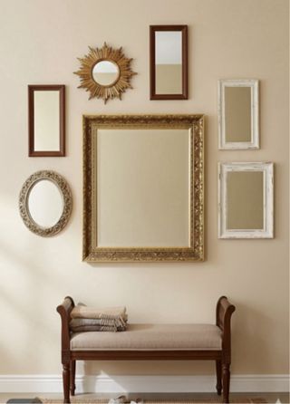 Espejo dorado tallado biselado