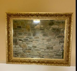 Espejo dorado tallado biselado