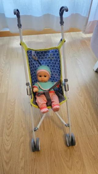 Muñeco bebé con carrito y accesorios