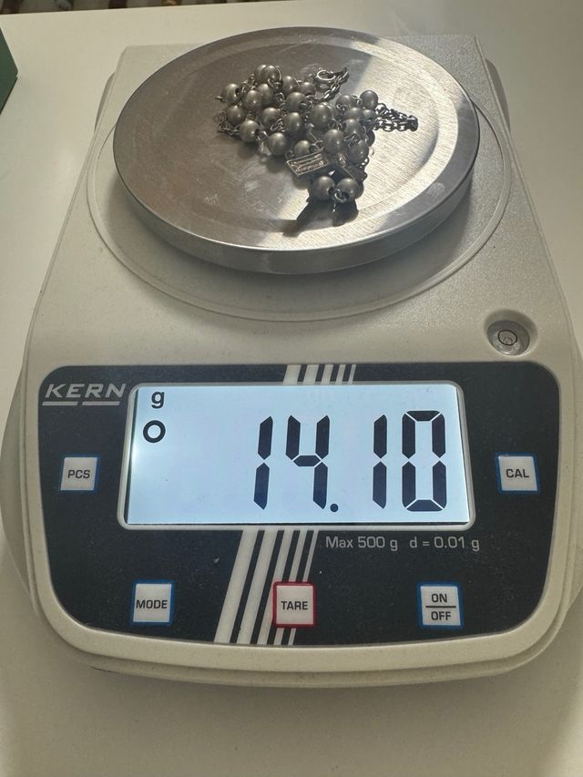 Rosario de plata con cruz