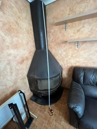 Estufa chimenea rincón hierro