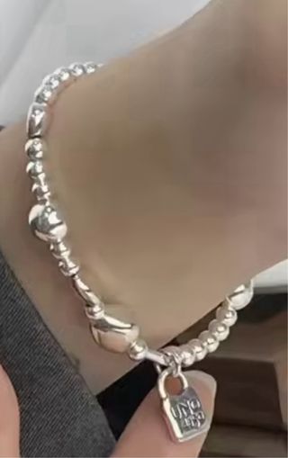Pulsera Plata con Dijes modelo uno de 50