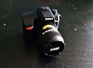 USB a forma di fotocamera Nikon
