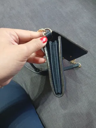 Bolso bandolera Michael Kors negro y dorado