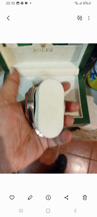 Caja Rolex plateada y de acero