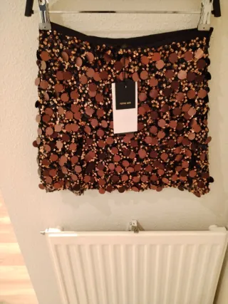 Minifalda Zara lentejuelas negra y dorada T.XS