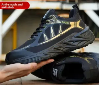 Botas de seguridad negras y doradas