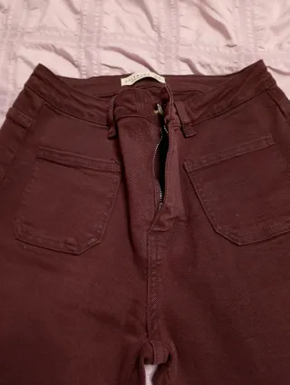 Vaqueros acampanados granates mujer