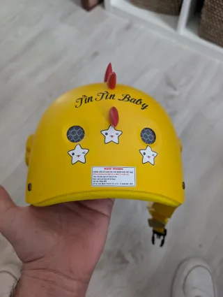 Casco infantil bicicleta dinosaurio amarillo