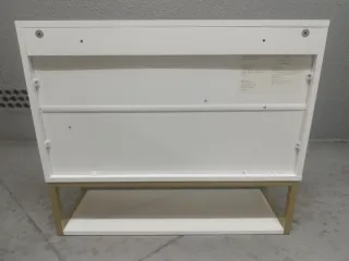 Armario de baño blanco con patas  doradas.