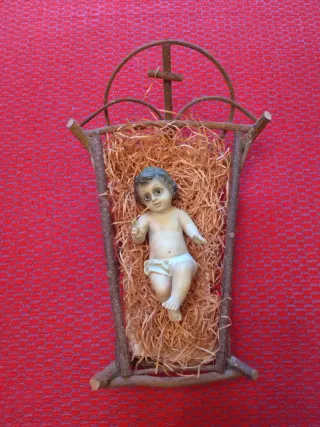 Niño Jesús en cuna de ramas