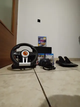 PS4 + 3 juegos + volante y pedal etc