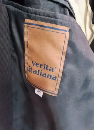 Completo uomo grigio mille righe.