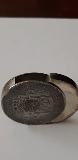 Encendedor de bolsillo, moneda.