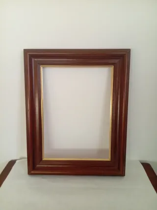 Marco de madera y metal dorado