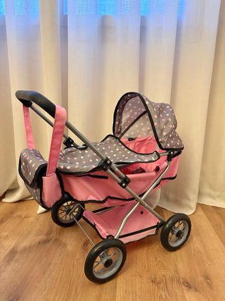 Carrito de muñecas rosa con lunares grises