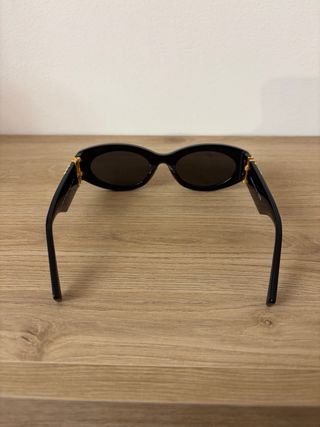 Occhiali da sole Miu Miu neri e oro