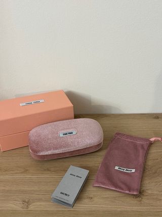 Occhiali da sole Miu Miu neri e oro