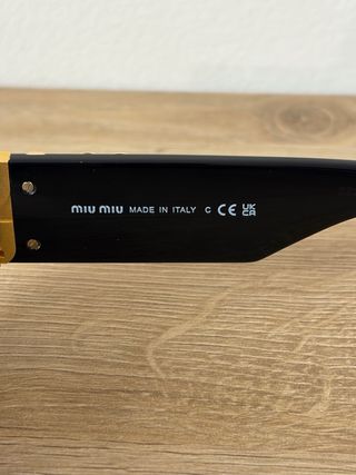 Occhiali da sole Miu Miu neri e oro