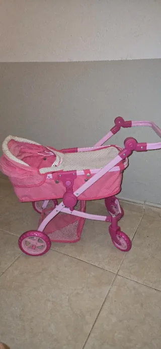 Cochecito de muñecas rosa