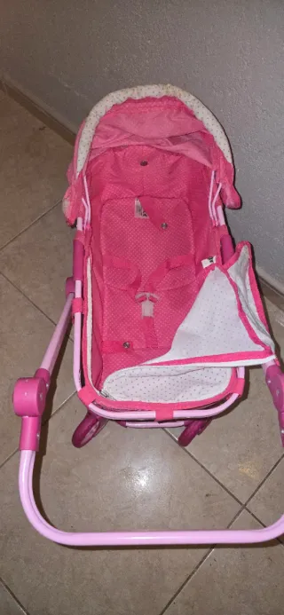Cochecito de muñecas rosa