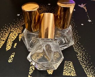 3 bottiglie di profumo vintage dorate