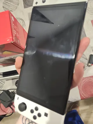 Nintendo Switch OLED con caja y accesorios