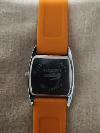 Reloj Lacoste Naranja y Plateado.nunca lo usé