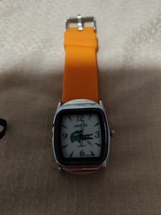 Reloj Lacoste Naranja y Plateado.nunca lo usé