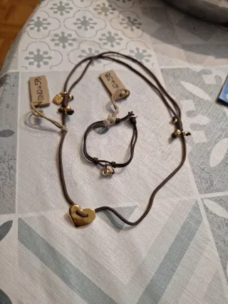 Collar corazón dorado y pulsera plata