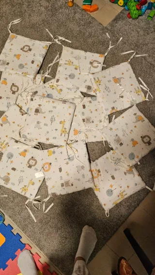 Protector cuna bebé con dibujos, pack 12 unidades