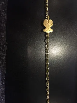 Collar cadena dorada con figura