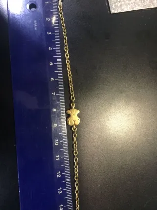 Collar cadena dorada con figura