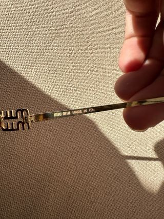 Gafas de sol Miu Miu doradas y moradas