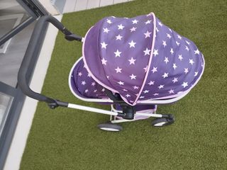 Silla de paseo para muñecas morada