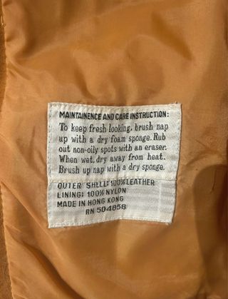 Abrigo de piel auténtica con cinturón