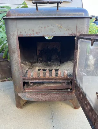 Estufa de leña hierro con puerta cristal