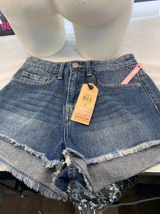 Shorts jeans vita alta strappati taglia 34