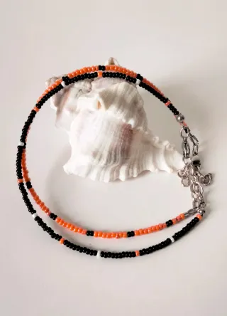 Coppia cavigliere perline nere e arancioni