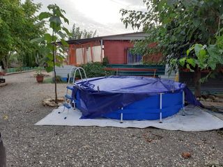 Terreno con caseta y porche