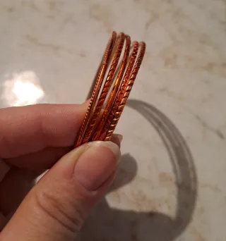 Set bracciali arancione e argento